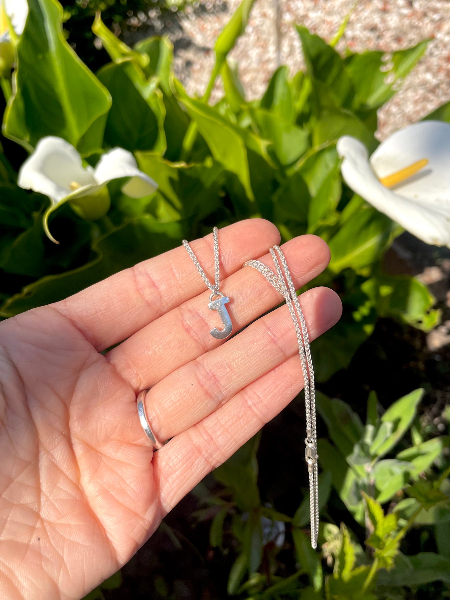 Tiny but chunky silver initial sandcast necklace