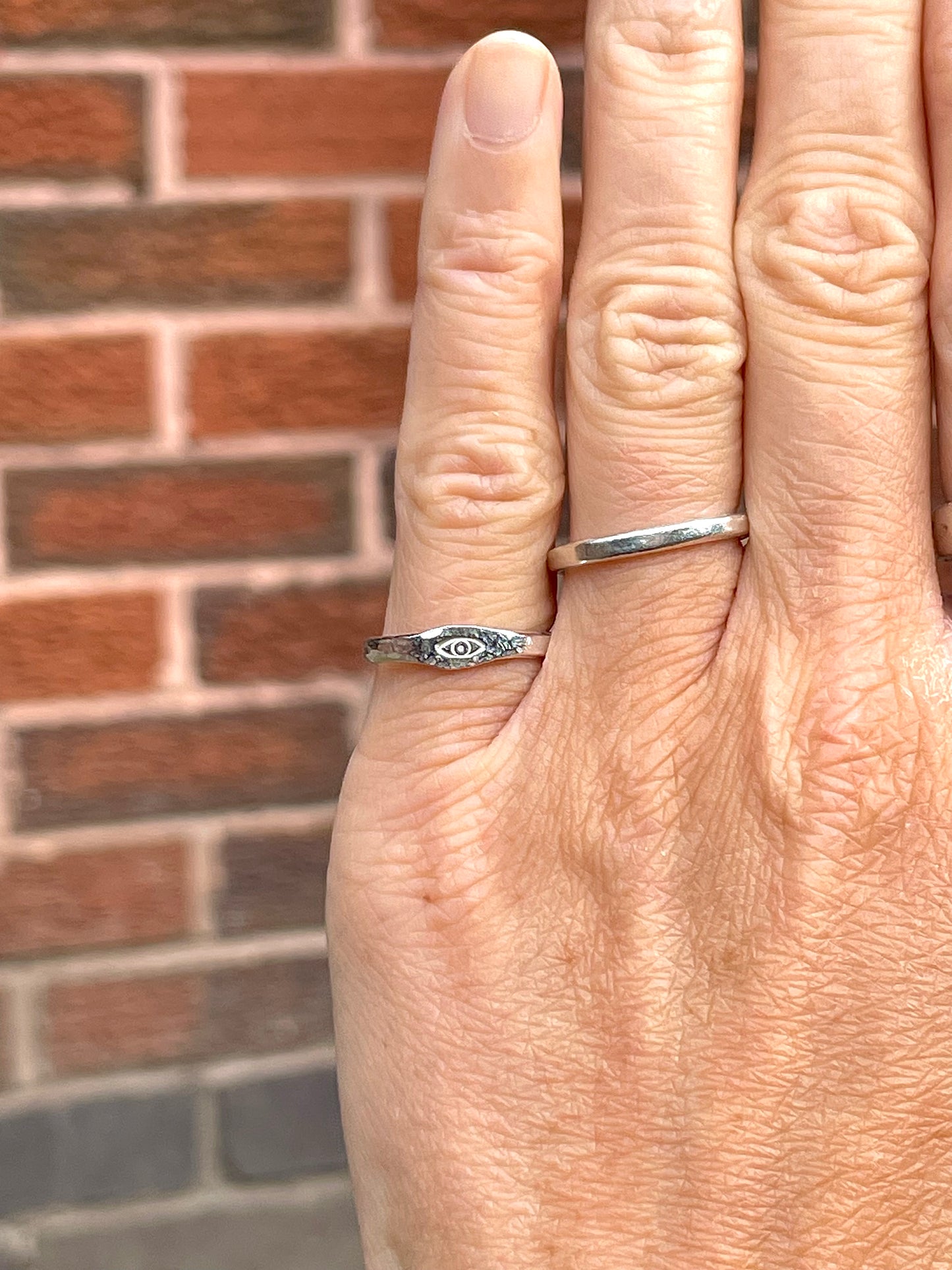 Tiny silver eye pinky ring