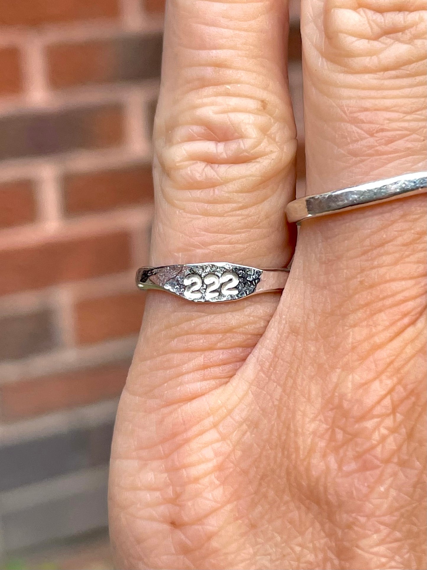 Tiny silver angel number pinky ring
