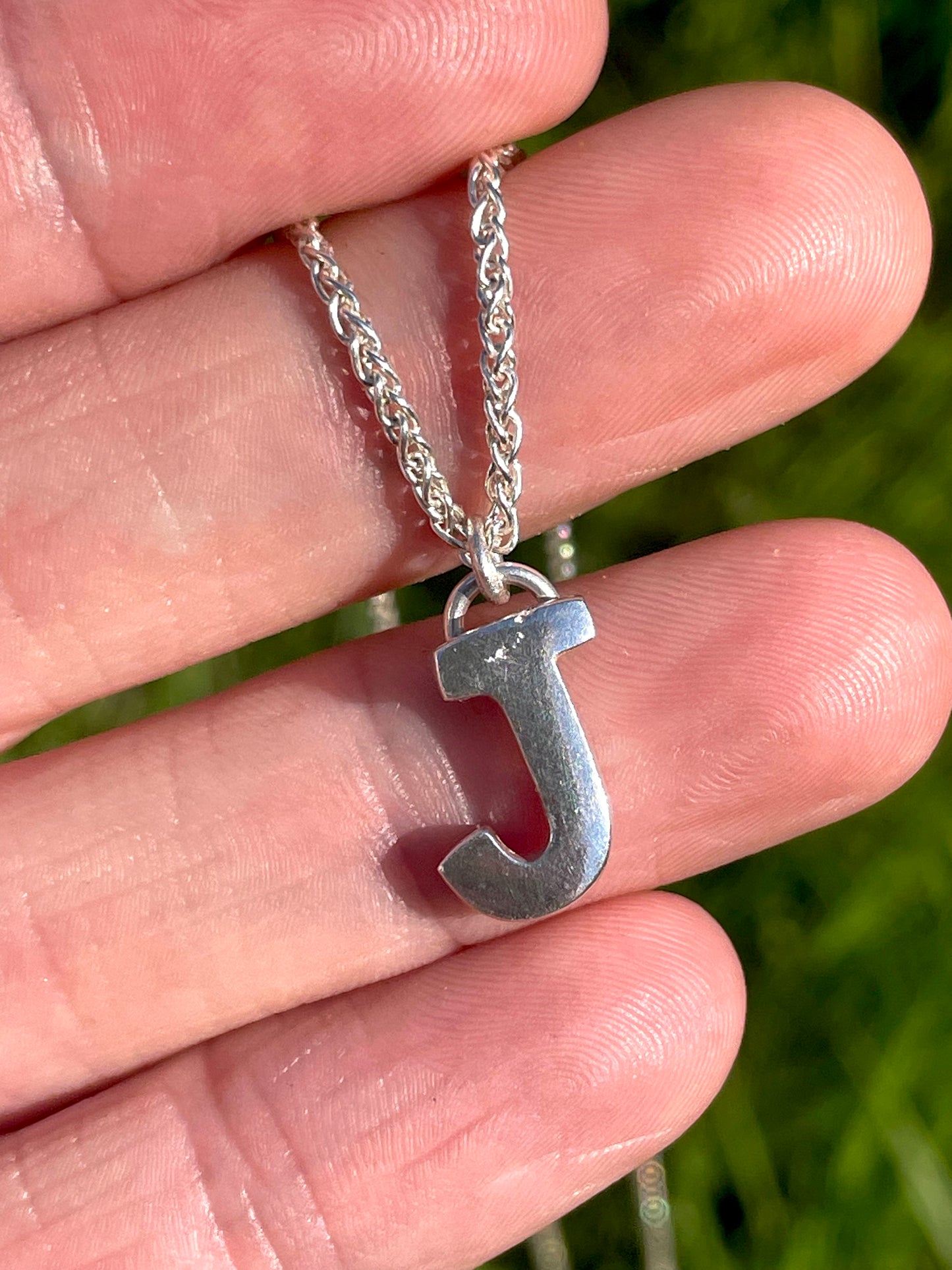Tiny but chunky silver initial sandcast necklace