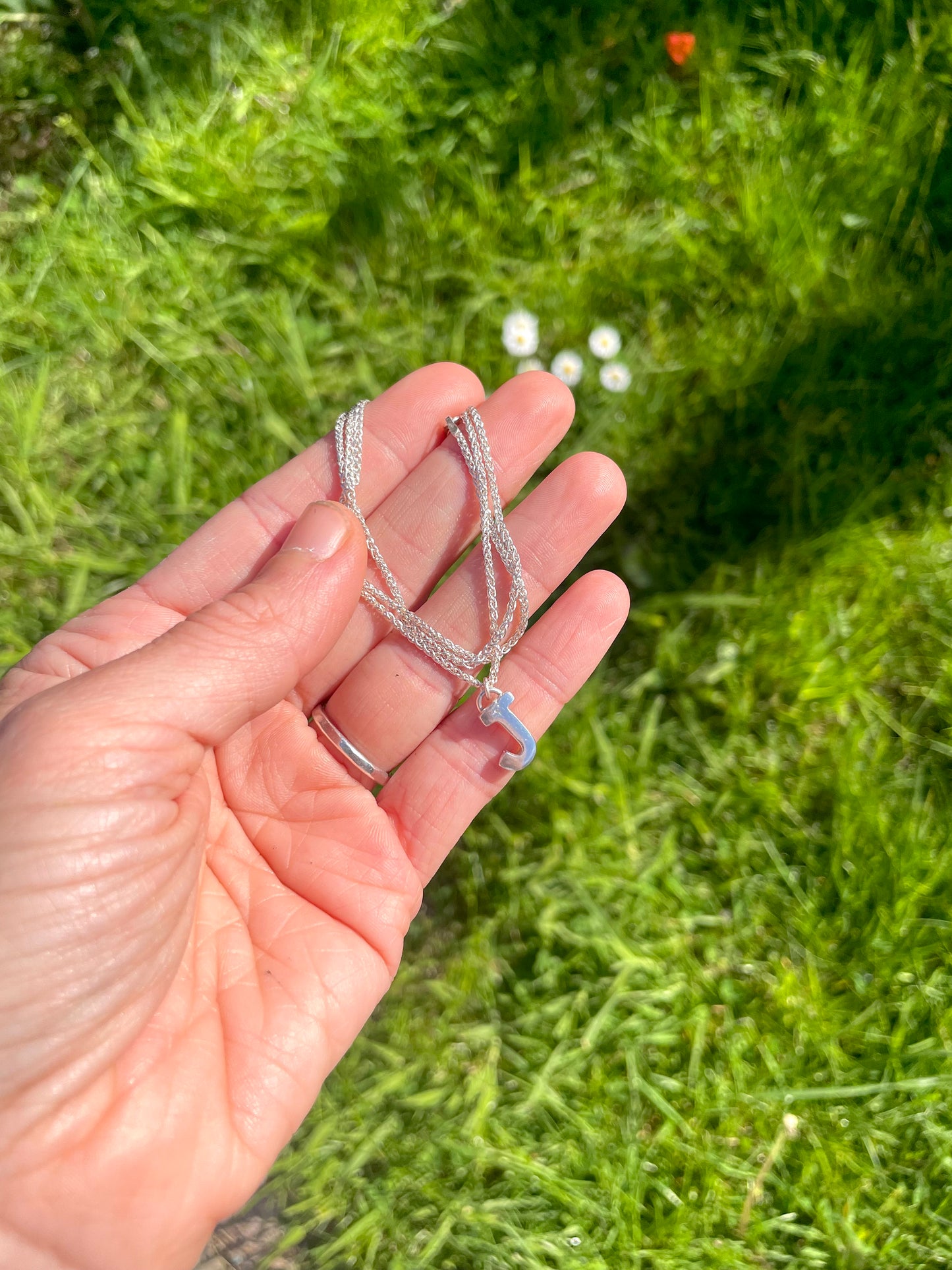 Tiny but chunky silver initial sandcast necklace