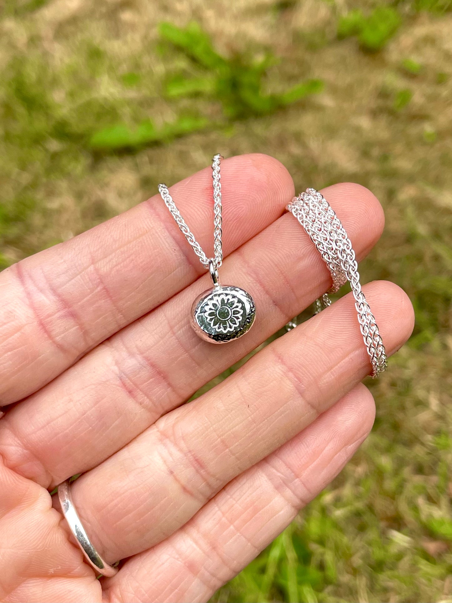 Sunflower | hand stamped silver pebble
