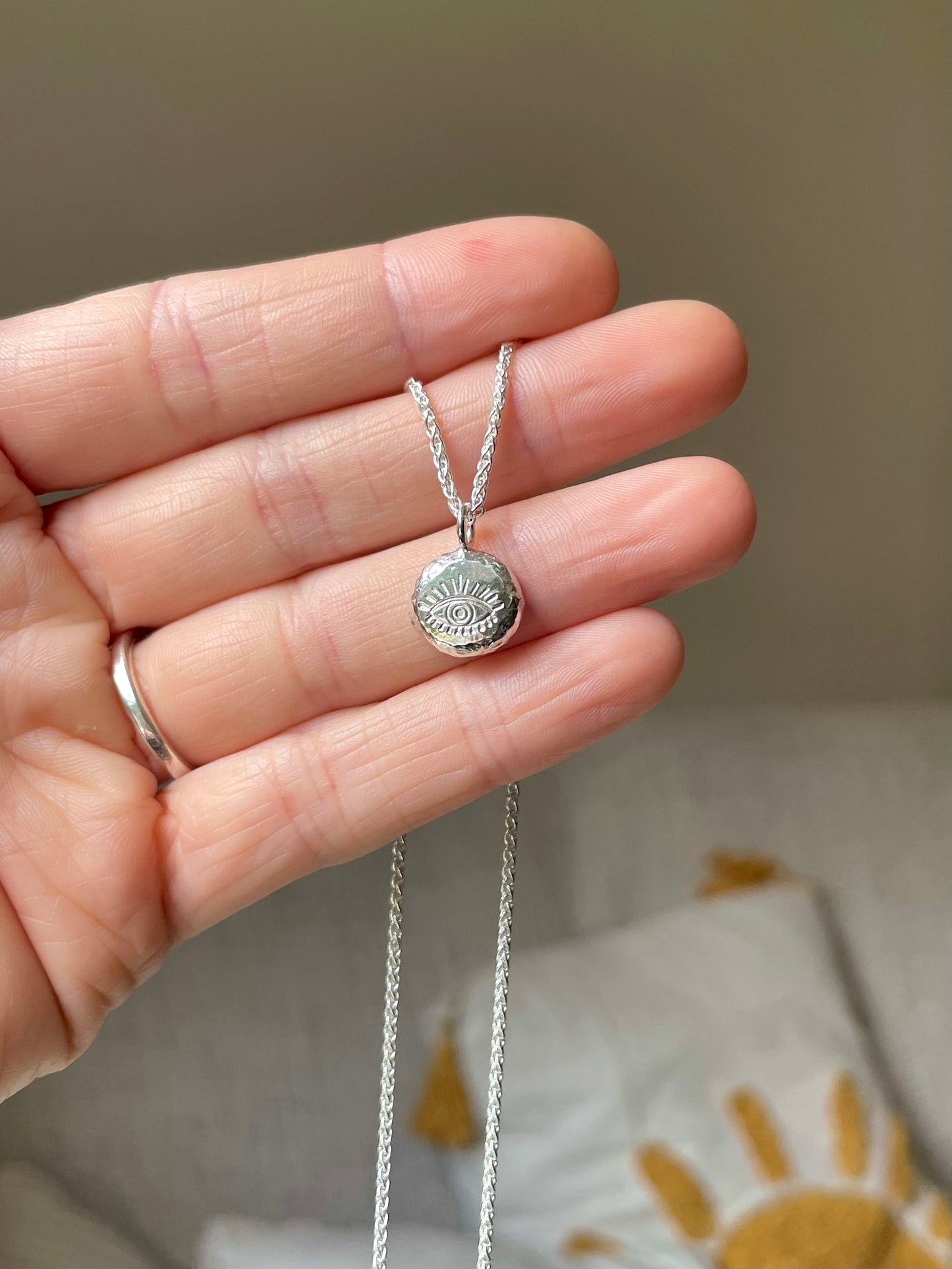 Eye | hand stamped silver pebble