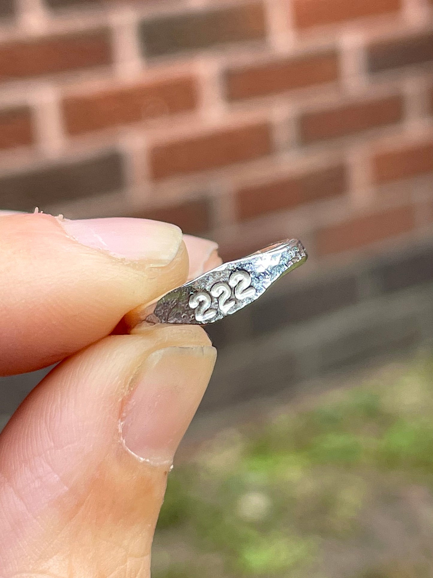 Tiny silver angel number pinky ring