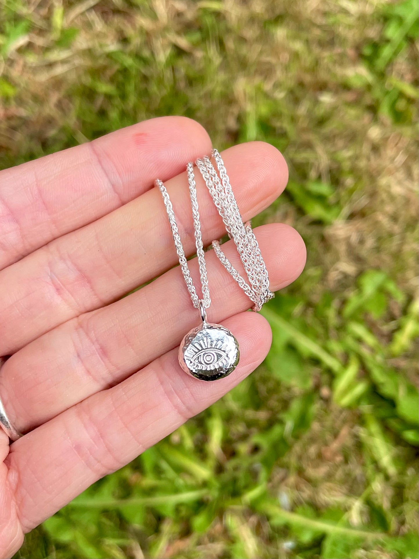Eye | hand stamped silver pebble
