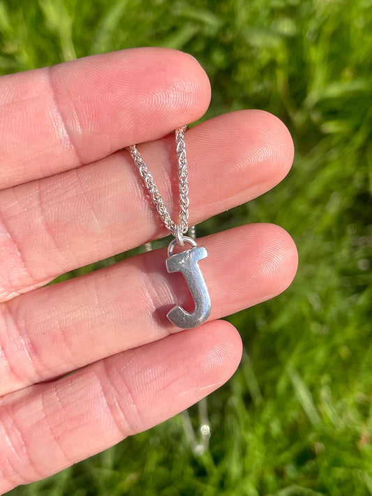 Tiny but chunky silver initial sandcast necklace