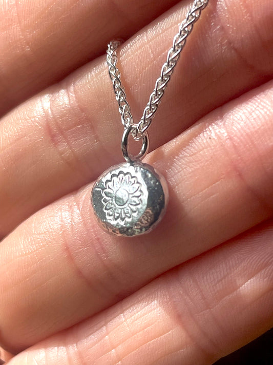 Sunflower | hand stamped silver pebble