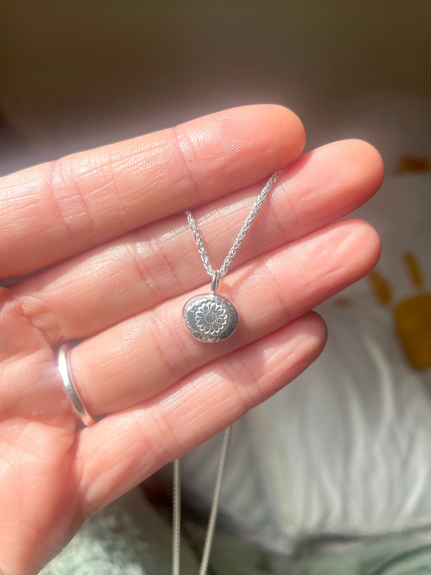 Sunflower | hand stamped silver pebble