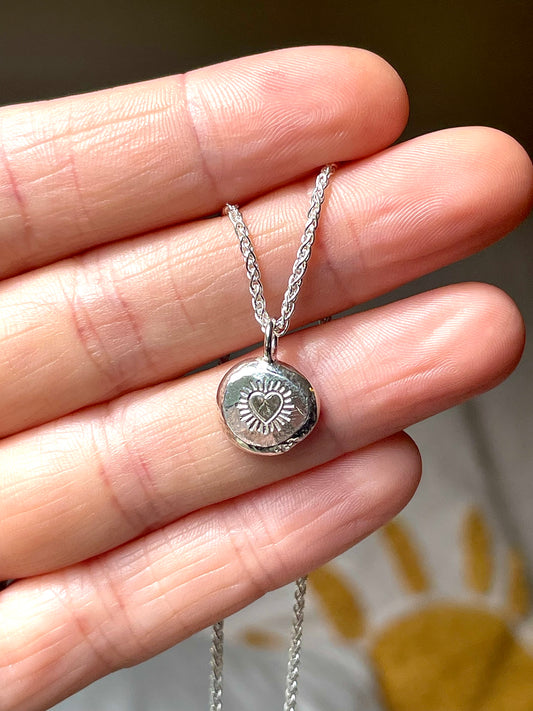 Heart burst | hand stamped silver pebble