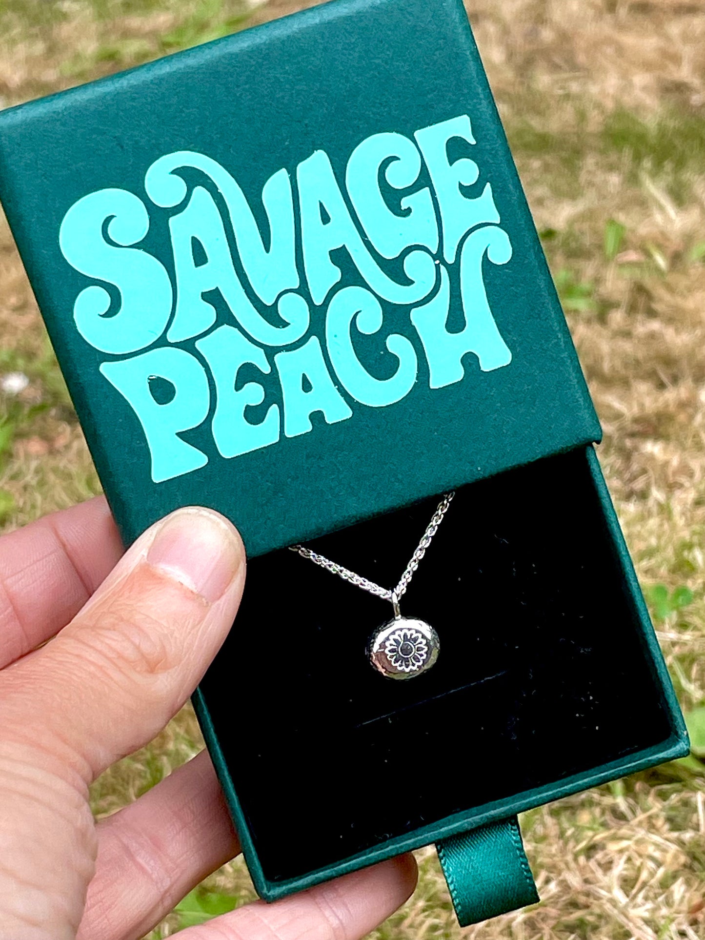 Sunflower | hand stamped silver pebble