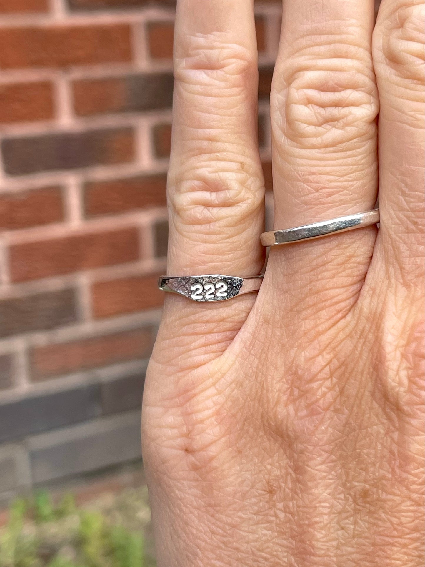 Tiny silver angel number pinky ring