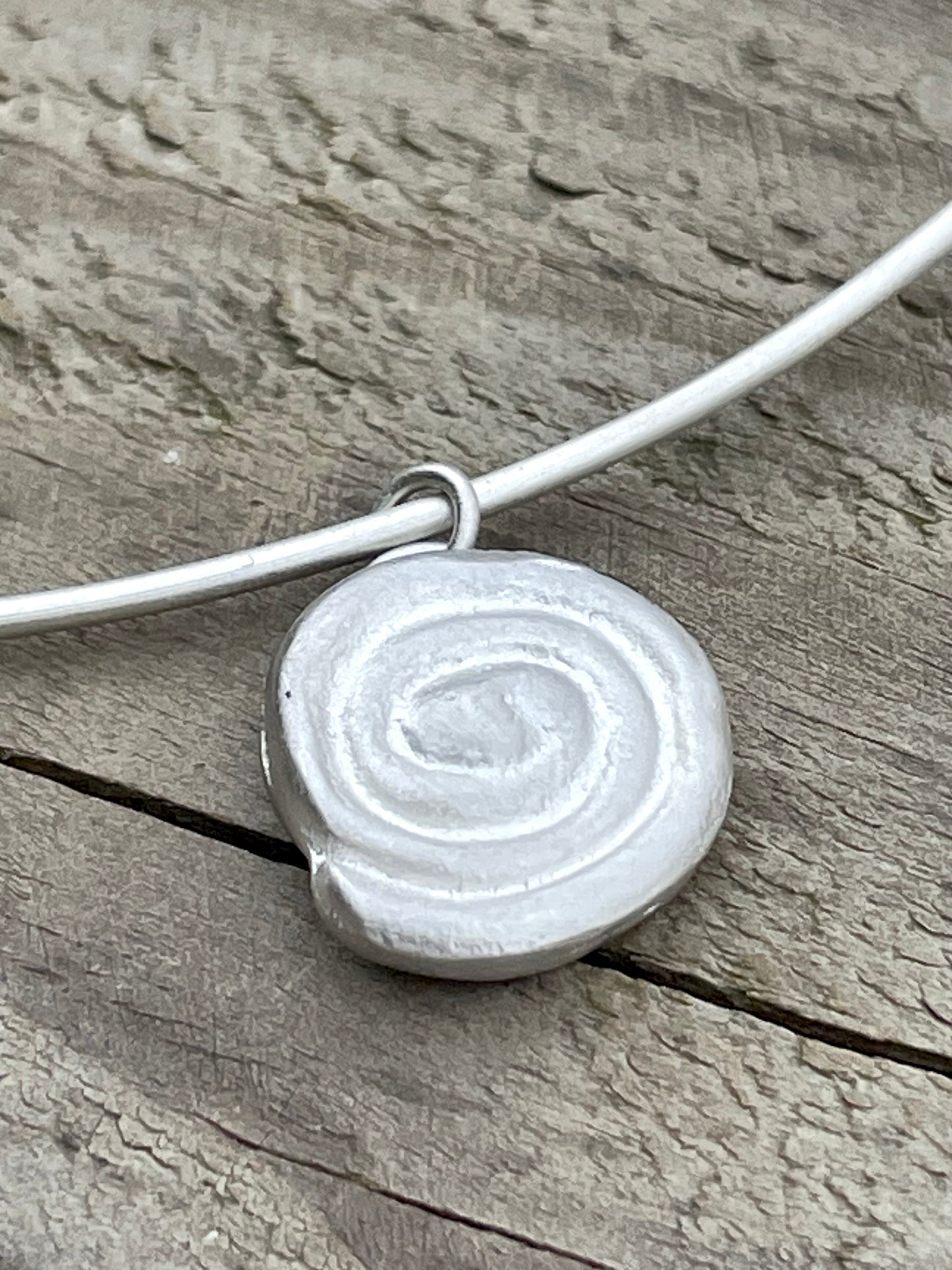 sandcast spiral pendant 🧿