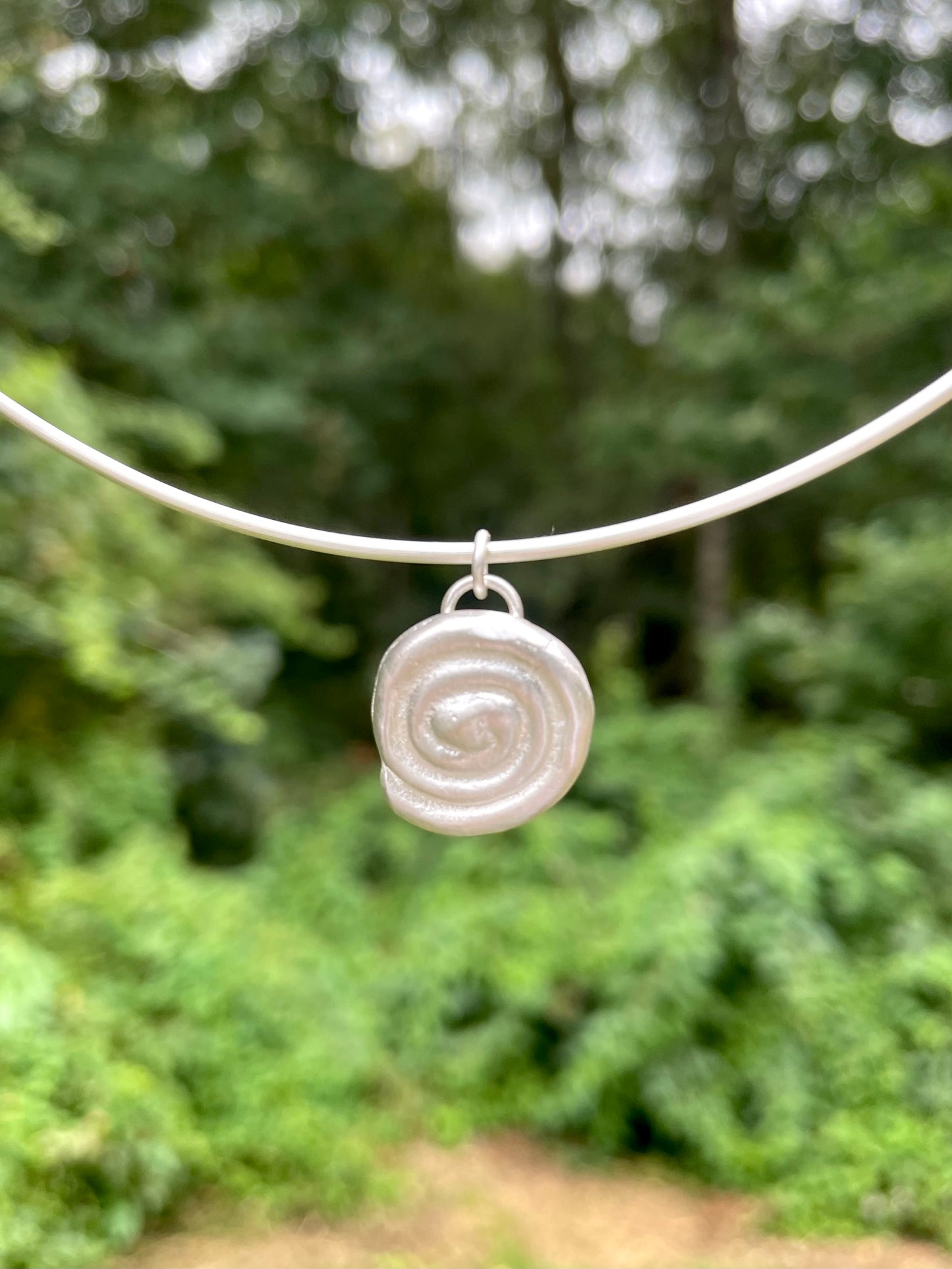 sandcast spiral pendant 🧿