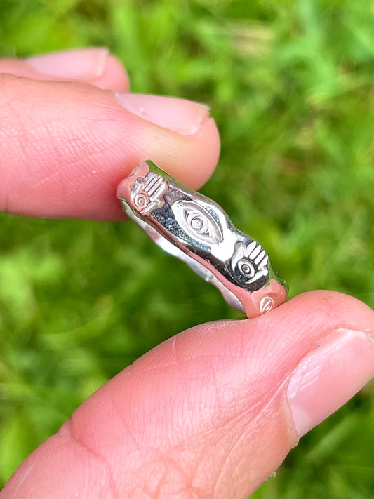 Sterling silver band with hand-stamped Eye and Hamsa symbols by Savage Peach