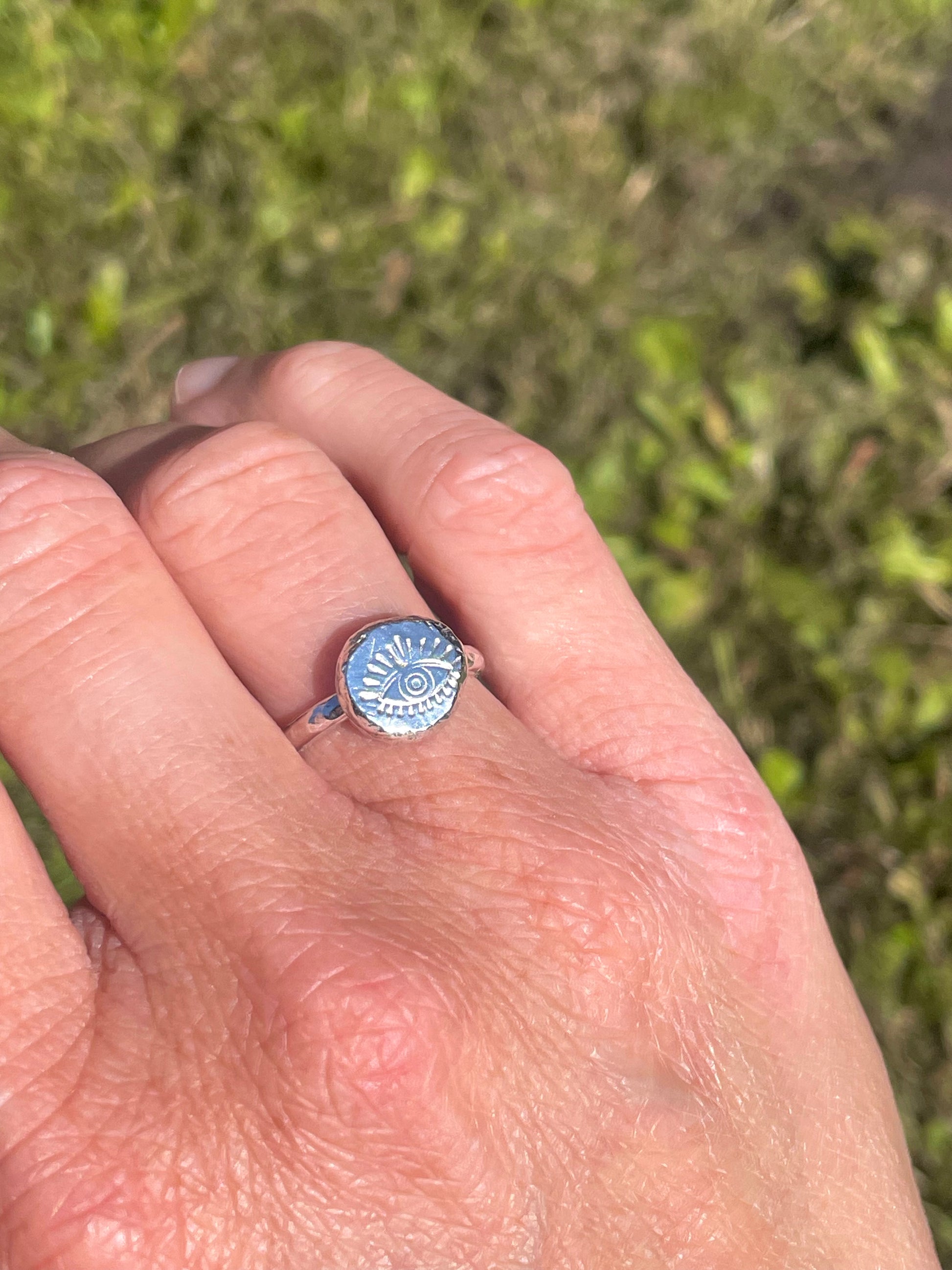 Eye pebble ring worn alone on hand – minimalist handmade protection jewellery