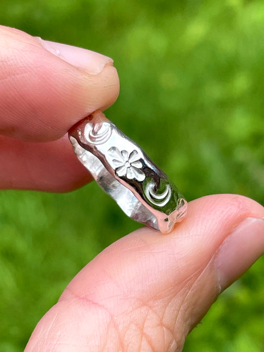 Sterling silver band hand-stamped with moon and star symbols by Savage Peach